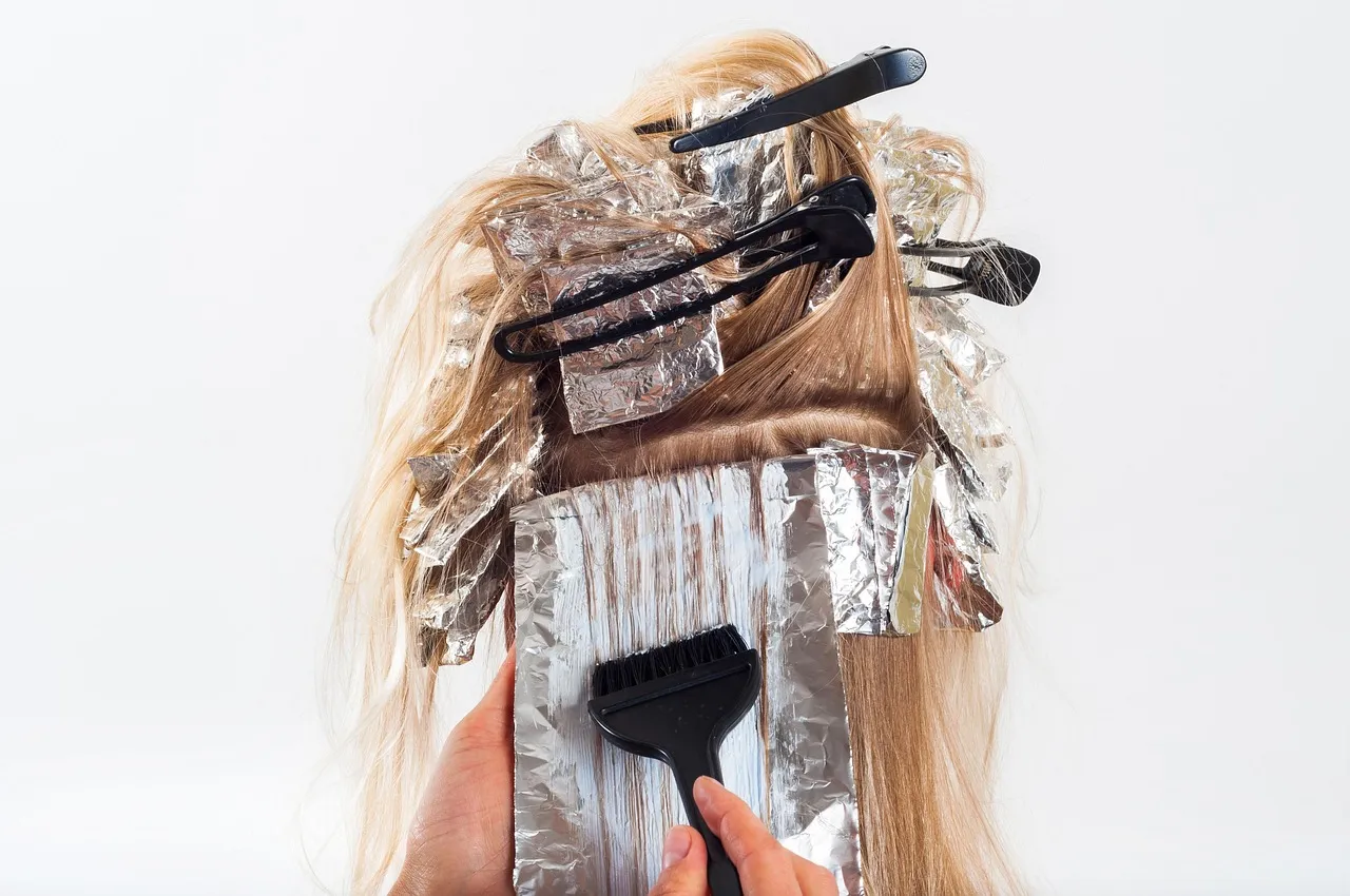 Foils and a color brush in sectioned blonde hair