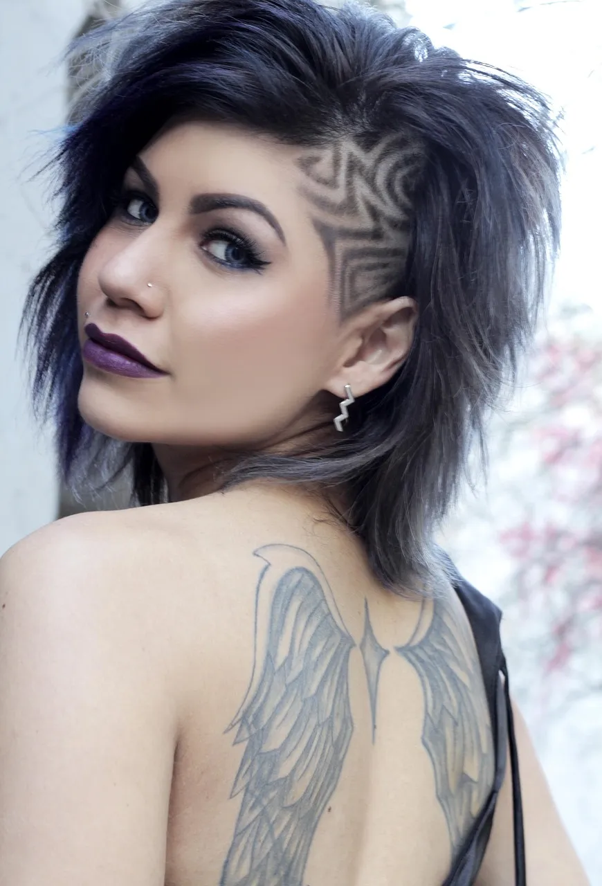 A violet-ash shag with a patterned undercut above the ear