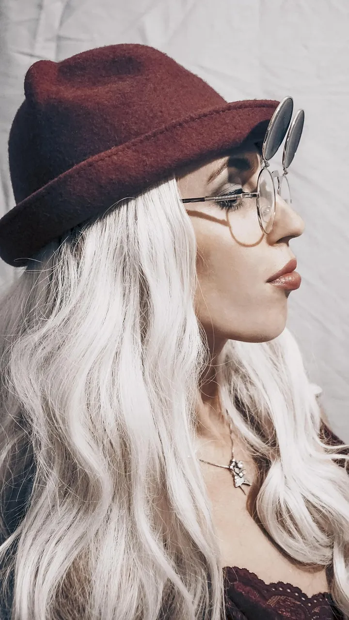 Long platinum blonde hair in profile