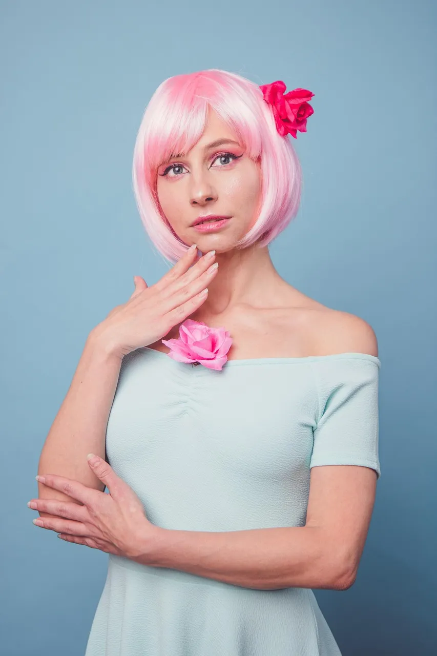 A chin-length pink bob with a blunt fringe